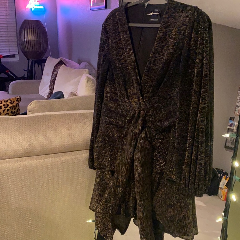 Beautiful gently used black and gold dress. Perfect for wedding.